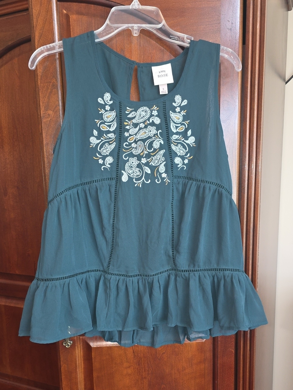 Embroidered Sleeveless Peplum Top